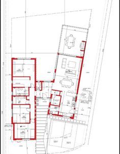 a drawing of a house with red lines on the floor and stairs to the upper level