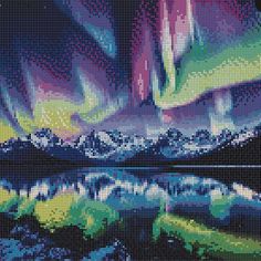 an image of the northern lights in cross stitch