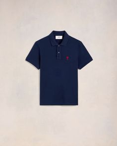 a blue polo shirt with a red pony on the left chest and a white background