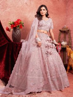 Elevate your bridal ensemble with this stunning Pink Mirror Zarkan Work Lehenga, crafted from premium net fabric. The lehenga is adorned with intricate handwork, featuring luxurious mirror Zarkan details that add a touch of glamour to your special day. The matching blouse, also made from premium net, complements the lehenga with its delicate handwork, creating a cohesive and elegant look. Whether you're the bride or attending a wedding, this ensemble is designed to make you shine with sophistication and grace. Ideal for bridal wear and wedding occasions, this lehenga offers both style and comfort. The premium materials ensure durability while providing a soft, comfortable fit. The timeless pink hue is perfect for traditional ceremonies, while the contemporary mirror Zarkan work adds a mode Blue Bridal Lehenga, Pink Bridal Lehenga, Saree Gown, Tulle Veils, Bridal Lehenga Choli, Pink Bridal, Blue Bridal, Rose Pastel, Wedding Lehenga