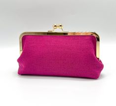 This elegant kiss lock clutch is handcrafted with a raspberry pink heavy linen woven fabric for the exterior and a petite floral cotton for the inner lining.  This structured pouch features plenty of interior space to keep essentials secure including cosmetics, cellphone, ID & cards, small wallet, sunglasses, and much more! Match with jeans or dress it up! This purse is perfect for you and all your favorite ladies -- it makes a great gift! 🌿 DIMENSIONS: -Approx. 8-3/4"L x 4"H x 2-1/4"W -8 X 3 inch metal kisslock frame -one 5.5 X 3 inch inner pocket  -two 2-3/4 X 3 inch inner pockets (card/ID slots).  🌿 OPTIONS: (choose one) -Clutch only (frame without chain loops) -Clutch with a 15" chain -Clutch with a 47" crossbody chain 🌿 COLOR & DESIGN: -Magenta Pink heavy linen woven fabric -Petite Elegant Pink Wallet With Zipper Pouch, Pink Rectangular Pouch For Gift, Pink Rectangular Pouch As Gift, Chic Rectangular Wallet As Gift, Chic Rectangular Wallet As A Gift, Pink Compact Cosmetic Bag Gift, Pink Clutch Coin Purse With Removable Pouch, Elegant Zipper Pouch Coin Purse, Elegant Rectangular Coin Purse For Personal Use