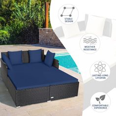 an outdoor daybed with blue cushions next to a swimming pool