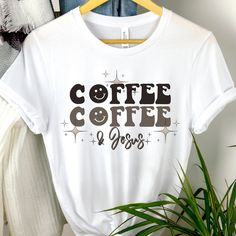 "These soft & comfy Bella Canvas t-shirts are sure to be your new \"must have more\" shirts!  Love Coffee tshirt Emoji t-shirt Vintage Smiley t shirt Vintage Coffee and Jesus shirt Faith tee Jesus and Coffee shirt Caffeine tshirt Womens graphic tshirt Womens Graphic Tee Gift for her Gift for women Womens gift Recommendations: *For a standard fit, stick with your typical size *For an oversized fit, size up *For a fitted shirt, size down. *Shirts are longer. Great for knots, Tucks, or nice coverage with leggings. *Unisex Cut. works great for Everyone! Women sizes: Small: 2-4 | Medium: 6-8 | Large: 10-12 | XL: 14-16 | 2XL: 18-20 | 3XL: 22-24 | 4XL: 26-28 Men sizes: Select your standard size. Details: *Soft, Breathable, & very comfy Bella + Canvas *Pre-shrunk fabric *Solid Colors: 100% combed Coffee-colored Relaxed Fit T-shirt With Slogan, Relaxed Fit Coffee T-shirt With Slogan, Coffee T-shirt With Funny Print And Relaxed Fit, Coffee Colored T-shirt With Funny Print And Relaxed Fit, Coffee Colored T-shirt With Funny Print In Relaxed Fit, Coffee-colored Graphic Tee With Funny Print, Relaxed Fit Coffee T-shirt With Funny Print, Coffee Colored Relaxed Fit T-shirt With Funny Print, Jesus And Coffee