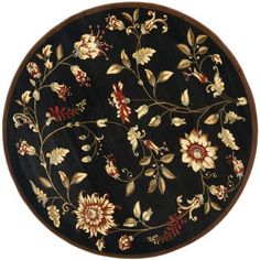 a round rug with flowers and leaves on black ground, isolated against a white background