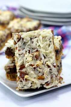 two pieces of cake sitting on top of a white plate