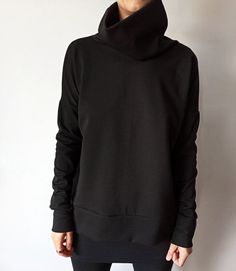 "Minimalist Black Women Sweater, Oversized Women's Heavier Jersey Top with High Collar, Loose Fitting Women Turtleneck Sweatshirt This minimalist black oversized top with a high turtleneck collar and extra long sleeves suits all types of figures. Fabric is a high-quality viscose lycra blend jersey, heavyweight that holds the geometrical shape well. It's a versatile style that can be dressed up or down for all occasions. With no zips, buttons or darts to deal with, this sweatshirt is a super quic Versatile Oversized Turtleneck Tops, Oversized Plain Top For Layering, Oversized Black Tops With Funnel Neck, Oversized Black Funnel Neck Tops, Black Funnel Neck Sweatshirt With Relaxed Fit, Black Sweatshirt With Relaxed Fit And Funnel Neck, Black Sweatshirt With Funnel Neck In Relaxed Fit, Oversized Funnel Neck Top For Fall, Black Drop Shoulder Tops For Fall