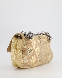 for more information on this item Brand - Chanel Model - Python Crochet Flap Bag Material - Python Colour - Beige Hardware - Ruthenium Accompanied by a Sellier dust bag Measurements – 28cm × 20cm × 7cm Code - 11 Series Date - 2006 - 2008 Ref - 030603 Please note we are not affiliated with the brands we sell Please note that all of our items are unless stated otherwise and purchasing through us is contributing to an ethical and sustainable fashion future. All our items come with an . All sales are final. You are making great choices for the planet and for yourself, Love Sellier. Luxury Beige Shoulder Bag With Chain Detail, Luxury Beige Shoulder Bag With Chain, Chanel Beige, Flap Shoulder Bag, Bag Measurements, Chanel Model, Colour Beige, Vuitton Bag, Flap Bag