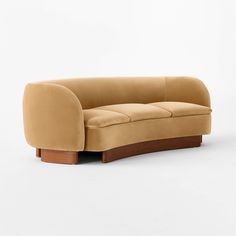 the curved couch is made from wood and has a tan colored upholstered fabric