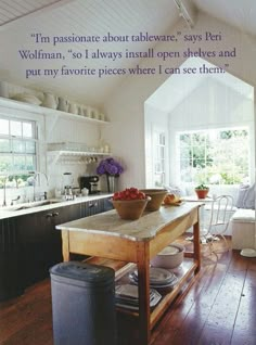 a wooden table sitting in the middle of a kitchen