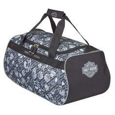 Harley-Davidson Gray Tattoo Sports Duffel w/ Strap 99418-GRAY TATTOO. Made of lightweight, super strong water-resistant polyester. Self-healing nylon coil zippers. Industrial strength webbing used for shoulder strap and handles. Rubber feet on the bottom. Interior pocket. Size: 20" x 9" x 10". Lightweight, super strong water-resistant polyester Self-healing nylon coil zippers Industrial strength webbing shoulder strap & handles Rubber feet on the bottom Size: 20" x 9" x 10" Size: 20" x 9" x 10". Gray Tattoo, Logo Sport, Harley Davidson Logo, Business Backpack, Luggage Store, Grey Tattoo, Travel Duffel, Duffel Bag Travel, Classic Backpack