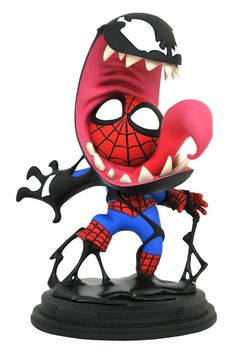 a toy figurine that is wearing a spiderman mask and holding a knife