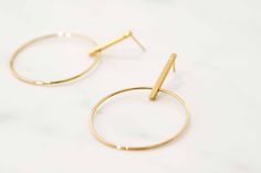 W H A T ∙ M A K E S ∙ T H I S ∙ S P E C I A L Simple but striking, these Minimal Large Circle & Stick Stud Earrings are minimal in design but big on impact. - we use only the finest quality materials - all components are 100% sterling silver or 18k Gold plated (Nickel free) - all pieces are designed in our happy studio D E T A I L S * Available in sterling silver or Crafted in Gold plated .925 sterling silver * Encrusted with zircon stones * Price is per pair * Very easy to put on All jewelr Modern Gold Open Circle Earrings, Gold Minimalist Open Circle Earrings, Minimalist Gold Open Circle Earrings, Modern Round Linear Earrings For Everyday Wear, Modern Round Linear Earrings For Everyday, Modern Gold Hoop Linear Earrings, Modern Gold Earrings With Simple Design, Simple Design Modern Gold Earrings, Modern Simple Design Gold Earrings