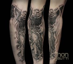 tattoos on the legs of men with an image of jesus and demon in black and grey