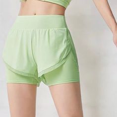 These Anna-Kaci Women's High Waist Layered Athletic Shorts offer a stylish, sporty look perfect for workouts or casual wear. Designed with a high waistband for added support, the shorts feature a breathable mesh lining and layered design for enhanced comfort. The side pockets provide convenient storage for essentials, making them ideal for running errands or hitting the gym. Crafted from lightweight, moisture-wicking fabric, these shorts keep you cool and comfortable during any activity. Bottom Workout, Athletic Skort, Layered Design, Active Wear Shorts, Stay Active, Tennis Skirt, Active Women, Sporty Look, Bottom Clothes