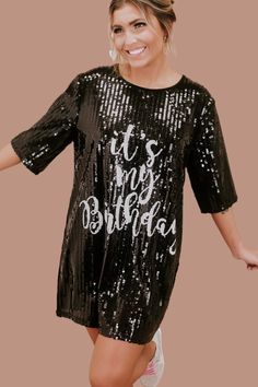 Party like it's your birthday! The It's My Birthday Sequin Dress features a round neckline, a stunning sequin design, a full lining, and the text " It's My Birthday" across the front in white. The ideal dress to accessorize and wear out on your big day! Short sleeves Round Neckline Above the knee hemline Sequin Pattern both front and back Full lining - not itchy at all Fit: oversized Fabric: 65% Polyester, 30% Cotton, 5% Spandex Imported Model Specs: Emily is wearing a size small in the photo.Ho Fitted Sequin Dress With Crew Neck, Black Sequined Celebration Dress, Black Sequined Dress For Celebration, Sequin Dresses For Bachelorette Party Season, Sequin Dress For Bachelorette Party And Party Season, Sequin Dress For Bachelorette Party, Black Embellished Dress For Celebration, Embellished Sequin Dress For Party Season Celebrations, Birthday Sequin Dress