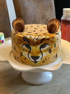 a cake decorated with an animal's face on a plate