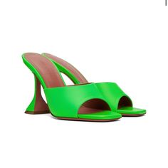 Worn Once Item Info Grained Lambskin Heeled Sandals In Green. Open Square Toe Logo-Embossed Padded Goatskin Footbed Modified Stiletto Heel With Rubber Injection Leather Sole With Rubber Injection Heel: H3.75 In Supplier Color: Fluo Green Upper: Lambskin. Sole: Leather, Rubber. Made In Italy Amina Muaddi Shoes Green, Green Evening Mules With Padded Heel, Green Open Heel Mules For Evening, Evening Green Open Heel Mules, Green Heels With Contrasting Heel Counter For Spring, Spring Green Heels With Contrasting Heel Counter, Green Square Toe Evening Heels, Green Square Toe Heels For Evening, Chic Green Mules For Evening