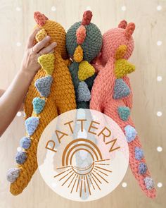 two crocheted stuffed animals are being held by someone's hand with the word pattern on it