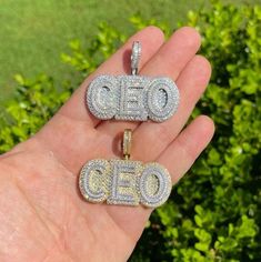 "Solid 925 sterling silver CEO pendant Be the Boss and wear this piece!! Super Iced out and very detailed. 3D effect 2\" wide...1\" tall (1.5\" w bale) Weighs about 26.5 grams Solid 925 sterling silver in either Rhodium Finish or 14k gold vermeil (two tone with silver letters) Iced with 4.5ct simulated diamonds (cz)...nice mix of natural & round stones Pendant only. Chains sold separately." Silver Cubic Zirconia Nameplate Jewelry, Classic Diamond Nameplate Jewelry, Engraved Diamond Nameplate Jewelry, Anniversary Cubic Zirconia Nameplate Jewelry, Silver Hallmarked Nameplate Jewelry, Personalized Silver Fine Jewelry, White Diamond Nameplate Jewelry, Luxury Engraved Diamond White Jewelry, White Engraved Cubic Zirconia Jewelry