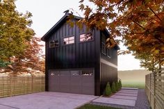 a black house with two garages in the front and one on the other side