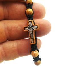 This beautiful bracelet is handmade in Medjugorje by a member of our family. Made using 10 olive wood beads, St Benedict cross in wood and Divine Mercy / Virgin Mary medal on closure.Adjustable sliding knot.9.5 inches (24 cm) when fully opened. Fits adults and teens a like.This bracelet is great gift for yourself or someone dear to you.Message card of Holy Lady from Medjugorje included. Also a free Medjugorje powers card with every multi item purchase.***NOTE: We also have Custom Gift Cards, all Adjustable Cross Jewelry With Wooden Beads, Adjustable Wooden Beads Cross Jewelry, Adjustable Wooden Beads Rosary Bracelet Gift, Adjustable Wooden Bead Rosary Bracelet Gift, Handmade Brown Rosary Bracelet As Gift, Jesus Bracelet, Adjustable Cord Bracelet, St Michael Medal, St Benedict Cross