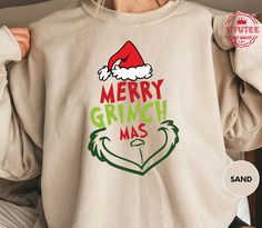 Get into the holiday spirit with our Merry Grinchmas Shirt and embrace the whimsical charm of the season. This Grinch Christmas Tee is perfect for those who love a touch of humor during the holidays. Our Holiday Shirt, designed for Women's Winter fashion, is a must-have addition to your festive wardrobe. The Holiday Tee is not just a piece of clothing; it's a statement of holiday cheer and style. Express your festive spirit with our Ugly Christmas Tee that stands out with its unique design and comfort. Shop now to elevate your seasonal style!  Etsy has it...! Please check Shirt and Sweatshirt sizes carefully.. Hi! Welcome to YiYuTee store, I'm so happy to see you here. My store's main goal is to make you happy. -We specialize in funny, customizable apparel shirts in different colors and st Merry Grinchmas Shirt, Womens Winter Shirts, Women's Winter Fashion, Merry Grinchmas, Bah Humbug, Text Shirt, Winter Shirts, Design Tshirt, Womens Winter