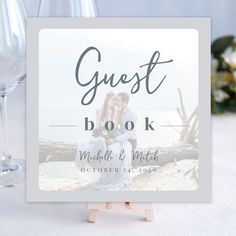 a wedding guest book sitting on top of a table