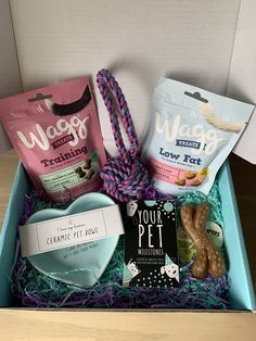 an open box containing dog treats and snacks