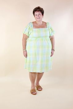 Introducing our Spring Serenity Dress, a vision of elegance and charm! Embrace its whimsical allure with balloon sleeves, a square neckline, and vibrant hues of green, blue, and yellow. Available in sizes small to 3XL, and fully lined for your comfort. Model: Abby is wearing a size large. Size Suggestions and Measurements: Small: 2-6 | Bust: 14 inches across the front | Length: 36 inches Medium: 8-10 | Bust: 14 inches across the front | Length: 37 inches Large: 12-14 | Bust: 15 inches across the Green Fitted Dress With Balloon Sleeves, Green Spring Dress With Elastic Sleeves, Spring Green Dress With Elastic Sleeves, Casual Green Dress With Elastic Sleeves, Green Puff Sleeve Dress With Gathered Balloon Sleeves, Green Midi-length Puff Sleeve Dress With Gathered Sleeves, Green Midi Length Puff Sleeve Dress With Gathered Sleeves, Green Midi Puff Sleeve Dress With Gathered Sleeves, Green Puff Sleeve Dress For Garden Party