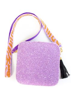 This Tiger Face Sequin bag is sure to turn some heads as you strut by! This custom hand-beaded bag is one of our favorites. Use it as an everyday bag or style for a Game Day purse! Make sure to check out the interchangeable straps! Zipper closure on top. The strap length is 48" long and the bag is 6x6. All hand-beaded products are available for pre-order. Items could take 4+ weeks to ship depending on available stock. All beaded accessories are hand-made, so please note that the stock informatio Everyday Beaded Pouch Bag, Purple Beaded Bag For Everyday Use, Beaded Purple Bag For Everyday Use, Purple Beaded Shoulder Bag For Everyday Use, Purple Beaded Bags For Everyday Use, Square Beaded Bag For Everyday Use, Everyday Beaded Crossbody Bag, Beaded Crossbody Bag For Everyday Use, Chic Beaded Travel Bags