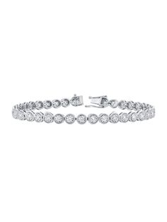 Elevate your everyday elegance with our Graduated Bezel Miracle Diamond Tennis Bracelet. This stunning bracelet features bezel-set, graduated round diamonds that shimmer with brilliance, thanks to the miracle setting that amplifies their sparkle. The miracle setting uses a faceted plate of gold around the diamond to enhance the diamond's appearance, creating an illusion of a larger stone. With a radiant center diamond surrounded by faceted gold, this piece is designed to add a sophisticated touc Diamond White Tennis Bracelet With Bezel Setting, Timeless Round Channel Set Bracelets, Timeless Round Diamond Bracelet Channel Set, Diamond Tennis Bracelet With Bezel Setting For Anniversary, Classic Round Tennis Bracelet With Bezel Setting, Timeless Round Diamond Bracelet With Channel Set, Timeless Round Channel Set Diamond Bracelet, Timeless Diamond Bracelet With Bezel Setting, Timeless Round Channel Set Bracelet