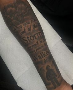 a man with a tattoo on his arm that says, when you come out of the storm you won't be able to walk in