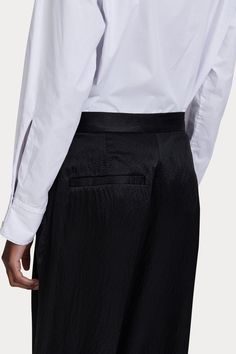 Long and classic wide-leg pleated pants in luxurious hammered satin silk. 100% Silk Zipper and button fly closure Slash pockets Made in USA Wedge Heel Boots, Resale Shops, Rachel Comey, Pleated Pants, Satin Silk, Knit Skirt, Short Jumpsuit, Blazer Dress, Denim Pant