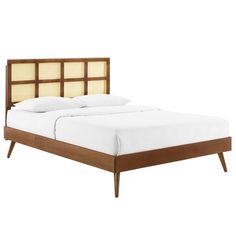 a bed with wooden headboard and foot board on it's sides, against a white background