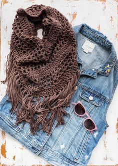 a pair of jeans and a knitted scarf