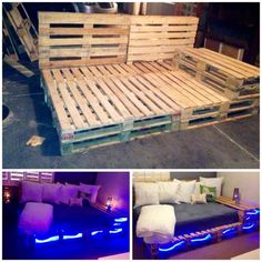 the bed is made out of wooden pallets and has blue lights on each side