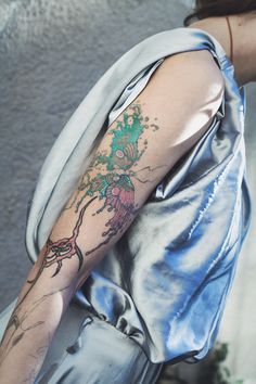 a woman with a tattoo on her arm