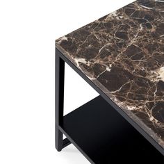 a marble top table with black legs on an isolated white background for use as a coffee table or end table