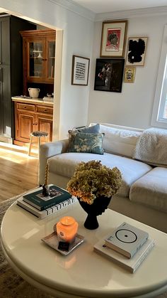 a living room filled with furniture and a white coffee table