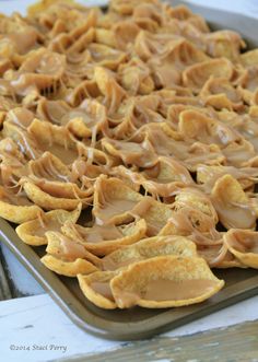 some food is sitting on top of a baking pan and ready to be baked in the oven