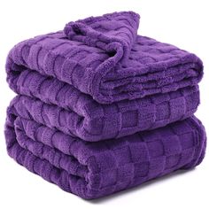 three purple towels stacked on top of each other