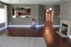 Love this wall color with the dark wood floors Bold Hallway, Pinting Ideas, Hardwood Colors, Painting Oak Cabinets White, Dark Wood Floors Living Room, Baltimore House, Basement Colors, Chocolate Walls, Sunset House