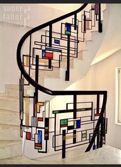 a spiral staircase with abstract art on it