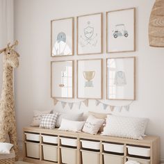 a baby's room with pictures and toys on the wall