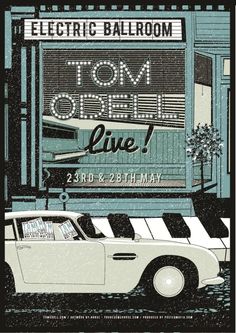 an old car parked in front of a building with the words tom's live on it