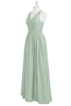 a green bridesmaid dress on a mannequin