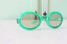 "RARE these are amazing! frame width=6 1/4\" arm width=5\" lens width=2\" Retro & Me loves these sunnies!! green sunnies one of a kind for sure foster grant great vintage condition 1950s-1960s perfect for pool parties love super retro! Thank YOU and please feel free to ask me any ?s:) Have a lovely day!! xoxo www.etsy.com/shop/retroandme #1125" Retro Green Plastic Sunglasses, Fun Green Sunglasses For Party, Party Green Sunglasses With Uv Protection, Green Tinted Sunglasses For Party, Green Tinted Party Sunglasses, Party Sunglasses With Green Mirrored Lenses, Green Mirrored Sunglasses For Party, Party Green Mirrored Sunglasses, Retro Green Sunglasses For Party