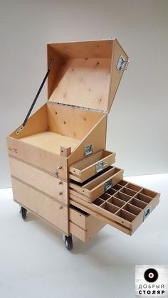 an open wooden box with drawers on wheels