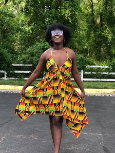 This kente Dress is gorgeous for the summer and very vibrant. Dress is halter style Has adjustable strings that tie to the neck and back Dress is high low style Material is light weight Very comfortable fit Strings can be tied at the shoulder or back Attention grabbing dress. Can be worn at the beach To parties and cook outs Fitted Multicolor Sundress With Tie Back, Yellow Sundress Halter Dress For Beach, Yellow Beach Sundress Halter Dress, Multicolor Backless Beachwear Dress, Yellow Halter Sundress For Beach, Multicolor Summer Halter Dress With Tie Back, Multicolor Halter Neck Beach Dress, Yellow Summer Halter Dress For Vacation, Yellow Halter Neck Sundress For Beach Season