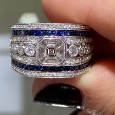 Dazzle everyone around you whenever you are wearing this mesmerizing sapphire and diamond ring. It looks so royal, and that is exactly what you will feel whenever you slip it on.Metal: 18K White GoldRound 136 Diamond Weight: 0.63ct t.w.Diamond 91 Baguette weight: 0.46ctw Sapphires 46 : 1.27ct t.w. Estimated production time is 4 - 5 weeks. Luxury Sapphire-colored Diamond Ring With Diamond Cut, Luxury Sapphire-colored Diamond Ring, Luxury Sapphire Diamond Ring With Diamond Cut, Luxury Diamond Ring With Lab-created Sapphire And Diamond Cut, Luxury Sapphire Diamond Ring With Vvs Clarity, Exquisite Diamond-cut Sapphire Ring, Exquisite Diamond Cut Sapphire Ring, Luxury Sapphire Octagon Rings, Luxury Asscher Cut Sapphire Diamond Ring